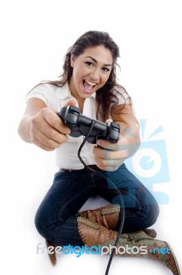 Sitting Woman Showing Remote Stock Photo