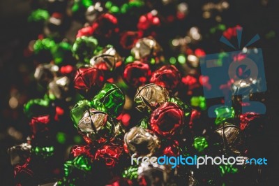 Sleigh Bells In Christmas Colors Background Stock Photo