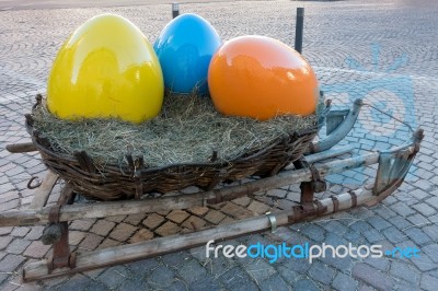 Sleigh With Three Painted Eggs In Ortisei Stock Photo