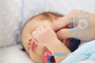 Slept Baby Hand Holding Mother Finger Stock Photo