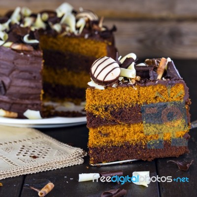 Slice Of Chocolate And Toffee Layer Cake Stock Photo
