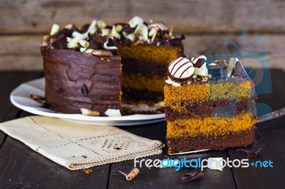 Slice Of Chocolate And Toffee Layer Cake Stock Photo