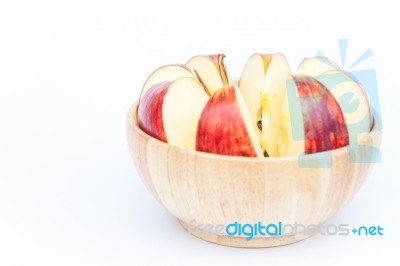Sliced Apple In Wooden Bowl Stock Photo