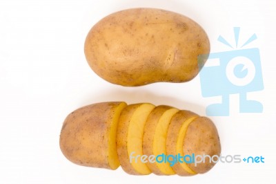 Sliced Potato And Whole Isolated On A White Background Stock Photo