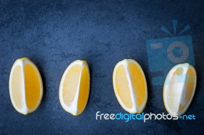 Slices Of Lemon On A Stone Table Stock Photo