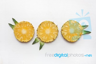 Slices Of Pineapple With Leaf Isolated Stock Photo