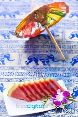 Slices Of Watermelon Served On Plate At Asian Restaurant Stock Photo