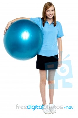 Slim And Fit Teen Girl Holding A Swiss Ball Stock Photo