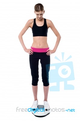 Slim Fit Tall Girl Measuring Her Weight Stock Photo