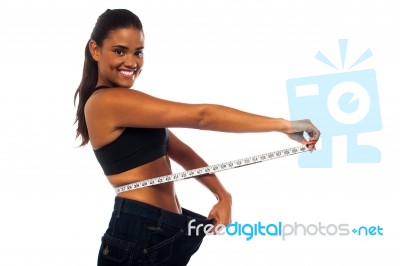 Slim Woman Measuring Her Waist Stock Photo