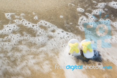 Slippers On Beach Stock Photo