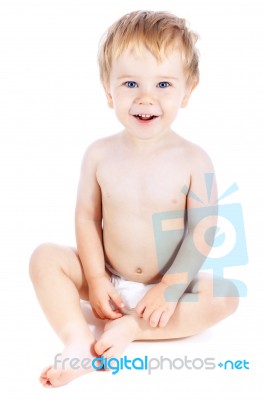 Smal Blond Boy With Blue Eyes With Happy Facial Expression Stock Photo