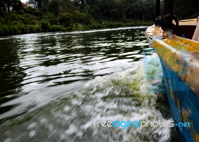 Small Boat Moving On Water Stock Photo