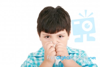 Small Boy Blowing Nose Stock Photo