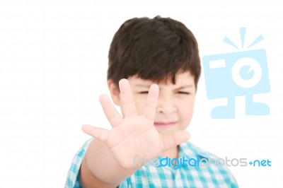 Small Boy Showing Stop Signal Stock Photo