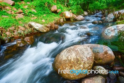 Small Waterfall With Fern And Rocks Located In Doi Inthanon Stock Photo