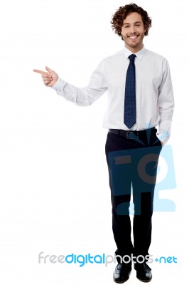 Smart Business Executive Pointing Away Stock Photo