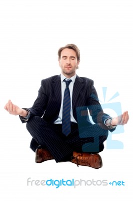 Smart Businessman Doing Meditation Stock Photo