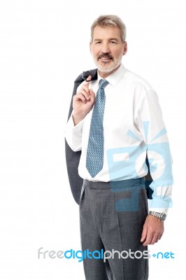Smart Businessman In A Relaxed Pose Stock Photo