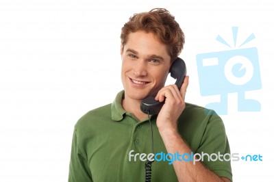 Smart Guy Answering Phone Call Stock Photo