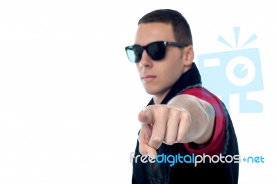 Smart Guy Pointing Towards Camera Stock Photo