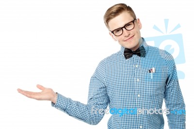 Smart Looking Guy Presenting Something Stock Photo