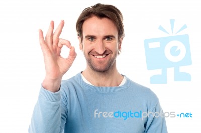 Smart Man Showing Okay Sign Stock Photo