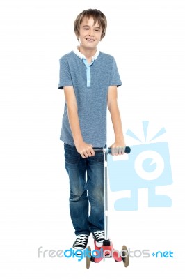 Smart Young Boy Posing With His Push Scooter Stock Photo