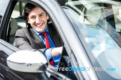 Smart Young Businessman Driving His New Car Stock Photo