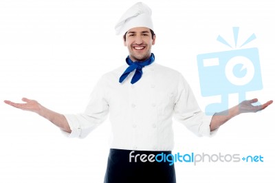 Smart Young Chef Welcoming Guests Stock Photo