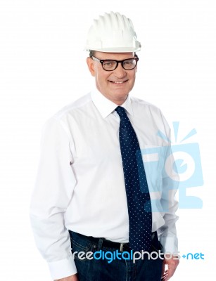 Smiling Aged Engineer With Hard Hat Stock Photo