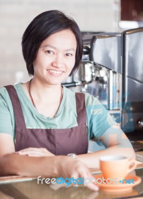 Smiling Asian Barista   Posing With Cup Of Coffee Stock Photo