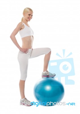 Smiling Athlete Lady stopping Ball Stock Photo