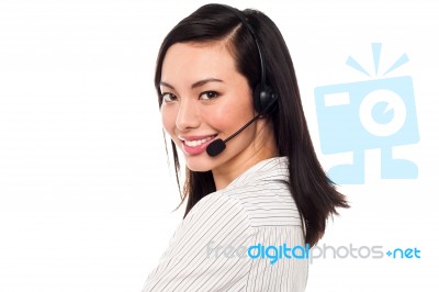 Smiling Attractive Call Center Executive Stock Photo