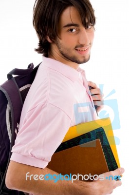 Smiling Boy Holding Bag And Books Stock Photo