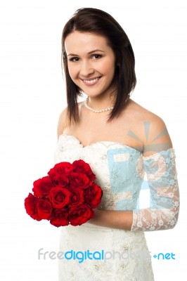 Smiling Bride With A Rose Bouquet Stock Photo