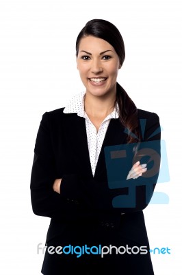 Smiling Business Woman With Folded Arms Stock Photo