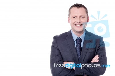 Smiling Businessman, Arms Folded Stock Photo