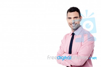 Smiling Businessman With Crossed Arms Stock Photo
