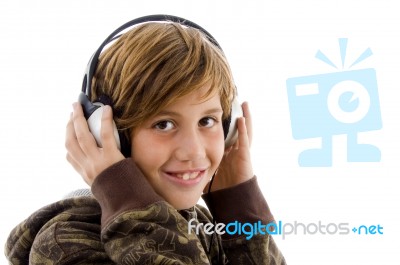 Smiling Child Enjoying Music Stock Photo