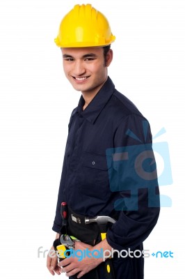 Smiling Construction Worker In Yellow Hard Hat Stock Photo