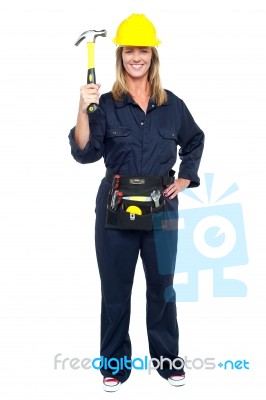 Smiling Constrution Worker Displaying Hammer Stock Photo