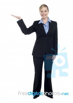 Smiling Corporate Lady Presenting Copy Space Stock Photo