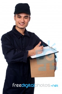 Smiling Delivery Man At Your Doorstep Stock Photo