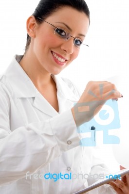 Smiling Doctor Holding Clipboard Stock Photo