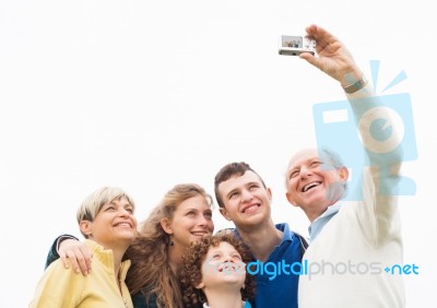 Smiling Family Taking Photos Stock Photo