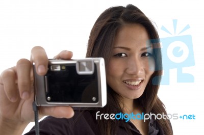 Smiling Female Showing Camera Stock Photo