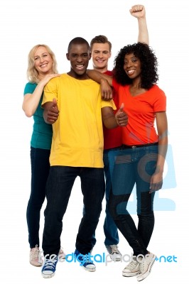 Smiling Friends showing thumbs up Stock Photo