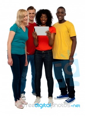Smiling Friends Using Tablet Pc Stock Photo