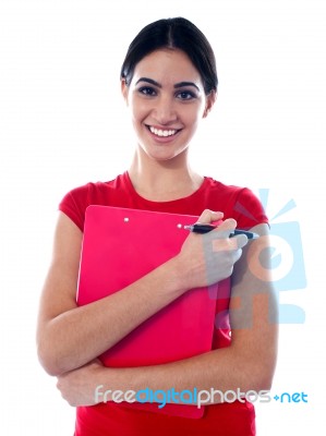 Smiling Girl Holding Clipboard Stock Photo